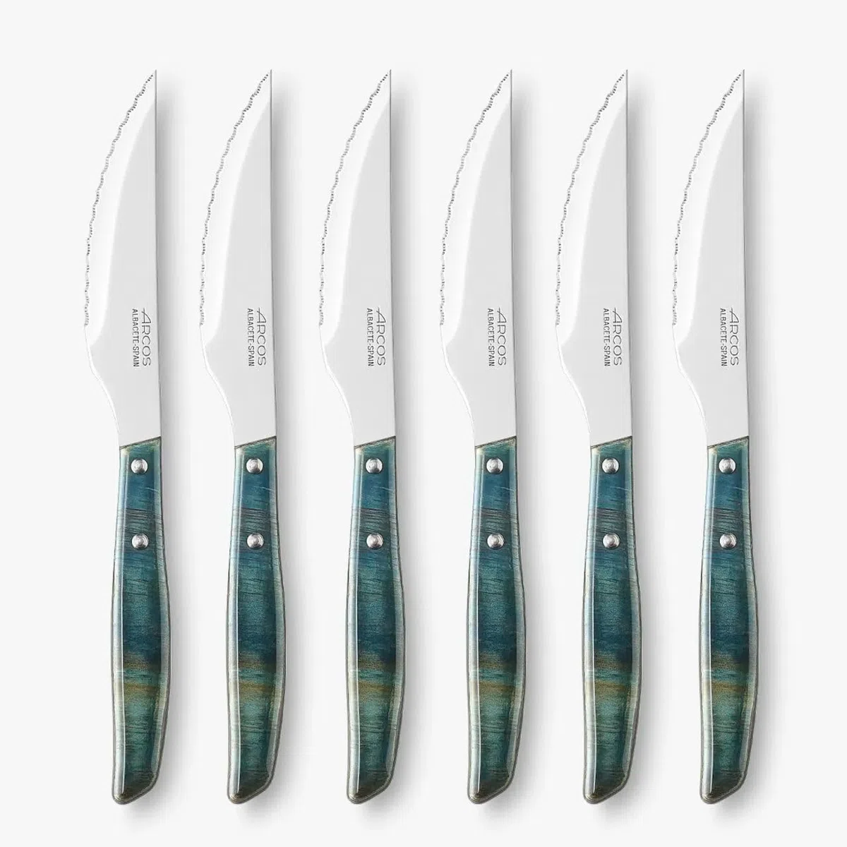 Arcos Serie Cuchillos de Mesa - Juego de Cuchillos Chuleteros 6 piezas - Hoja de Acero Inoxidable NITRUM de 110 mm - Filo Serrado - Mango Madera Comprimida - Color Azul